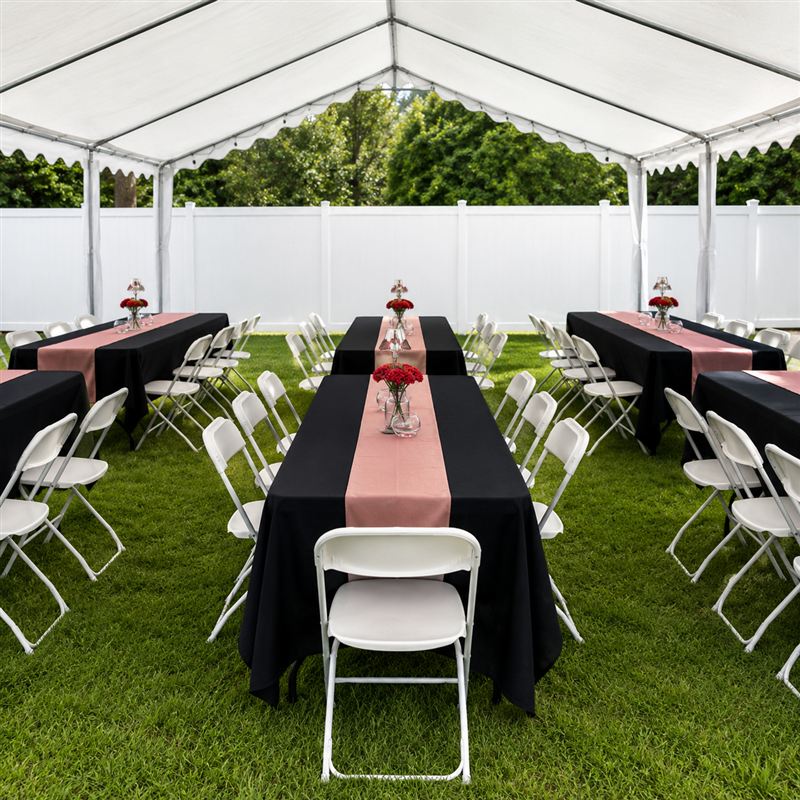 Party tables dressed in fresh pressed linens and table covers